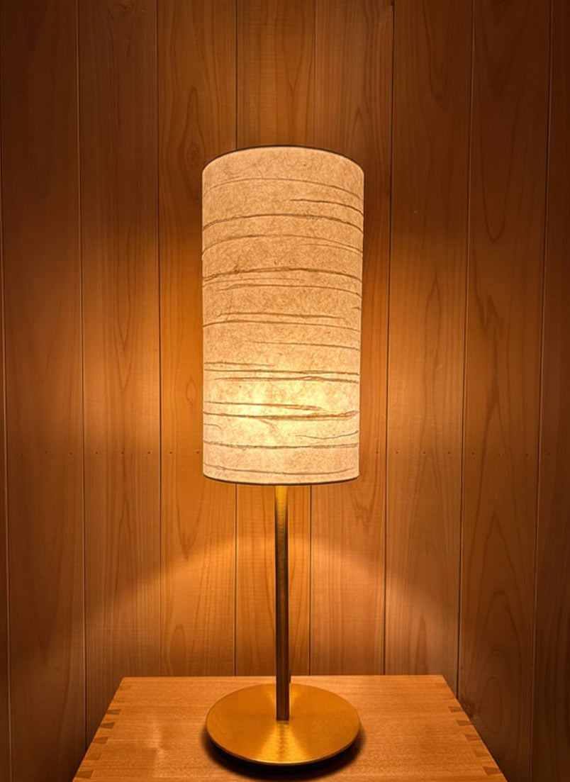 Handmade washi japanese paper table lamp with warm and tranquil glow.