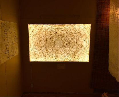 Circular pattern on a wall with warm lighting