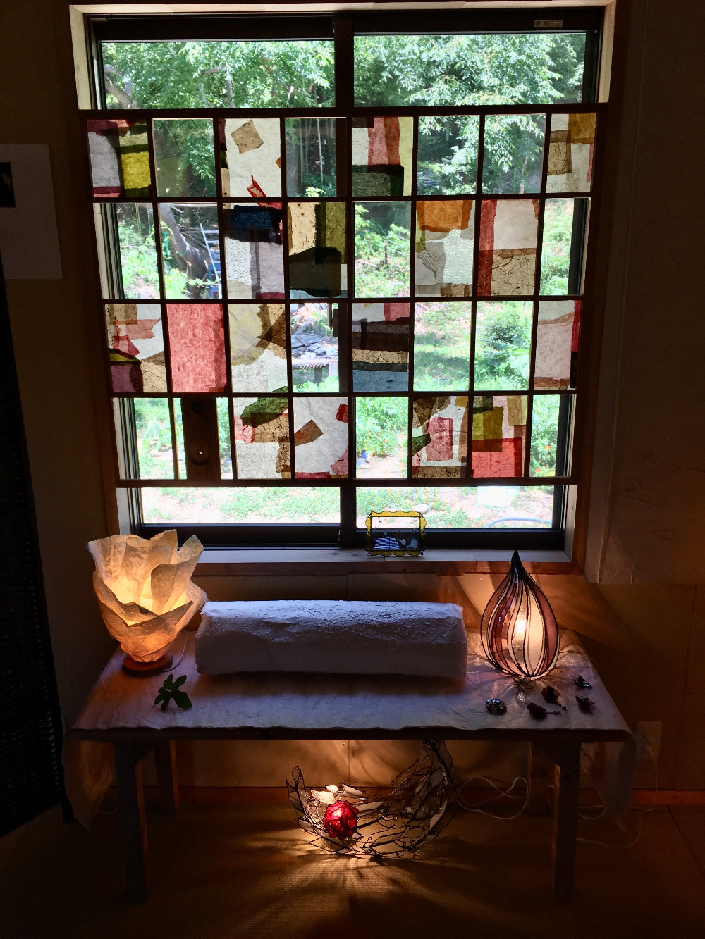 Washi used in shoji frame to create a patchwork window decor