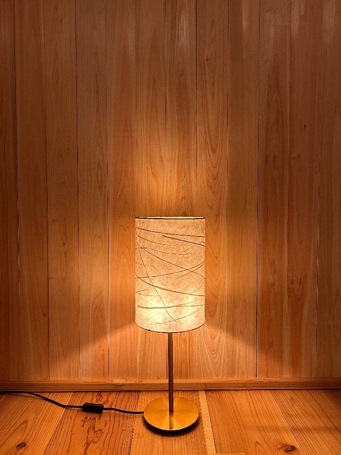 warm light emanating from washi lampshade