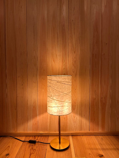 warm light emanating from washi lampshade