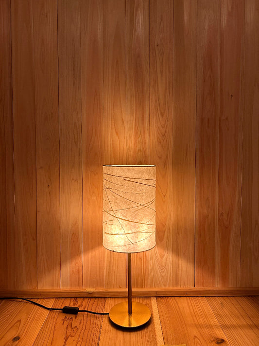 warm light emanating from washi lampshade
