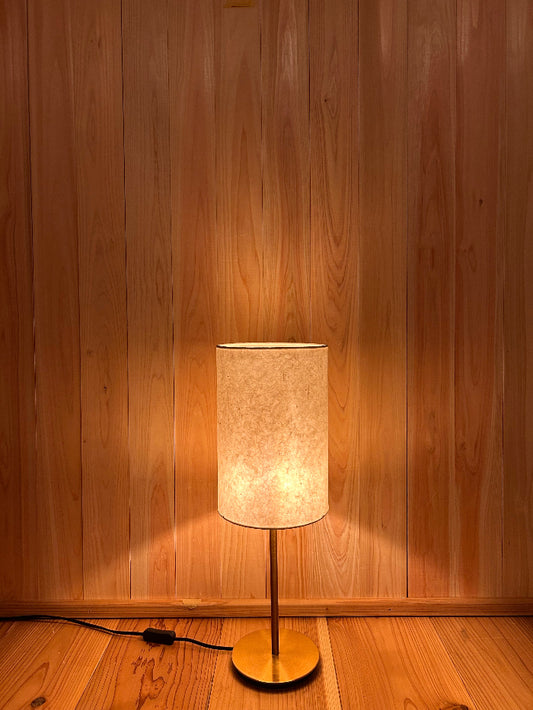 Washi floor lamp with a rectangular shade on a wooden floor.