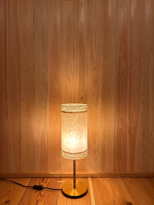 Washi lamp with a textured shade creates warm glow