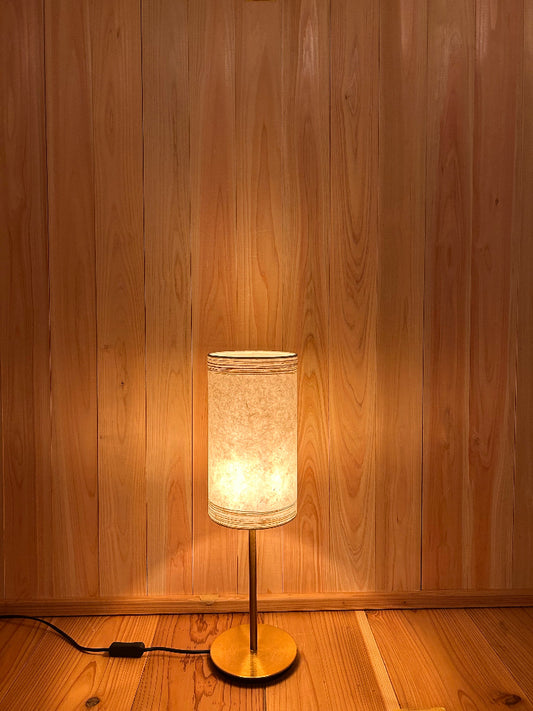 table lamp with washi shade creates warm and tranquil glow.