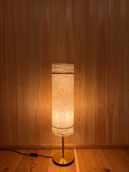 table lamp with washi shade creates a warm glow.