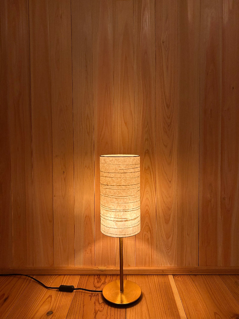 table lamp with washi lampshade creates a warm and tranquil glow.