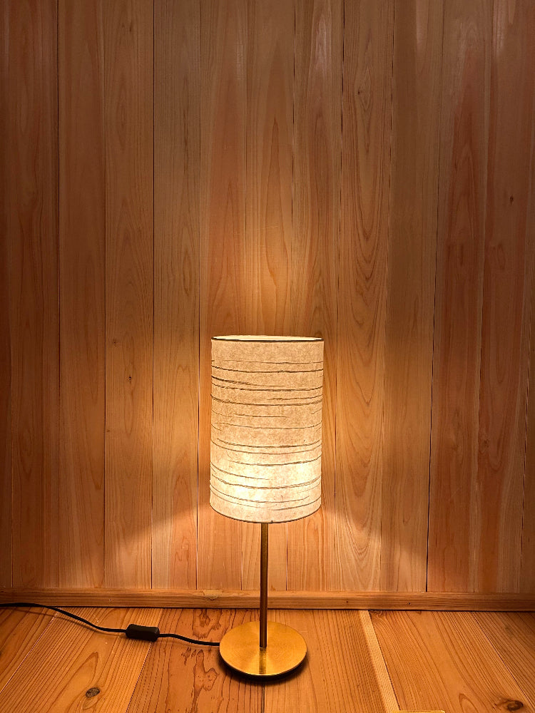 table lamp with washi shade creates a warm and tranquil glow.
