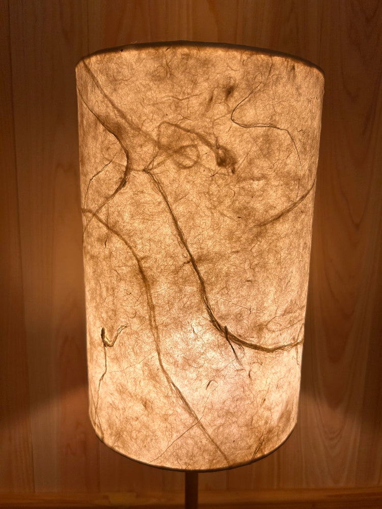 Decorative washi lamp with marble design on a wooden surface