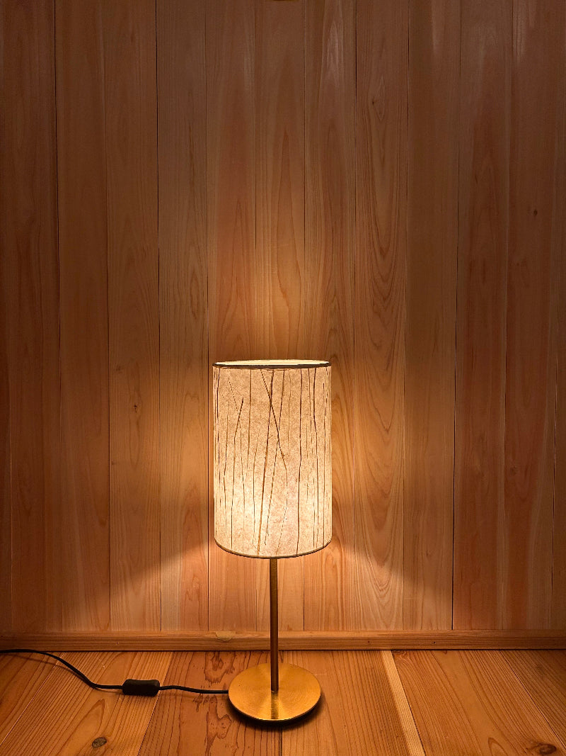 Table lamp with washi lampshade creates a warm and tranquil glow.