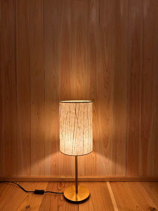 Table lamp with washi lampshade creates a warm and tranquil glow.